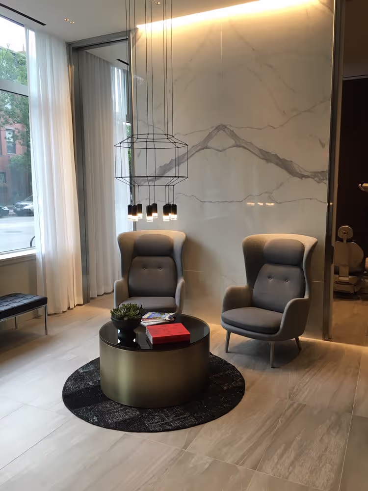 Elegant Smilebar lounge with modern armchairs and floor-to-ceiling windows