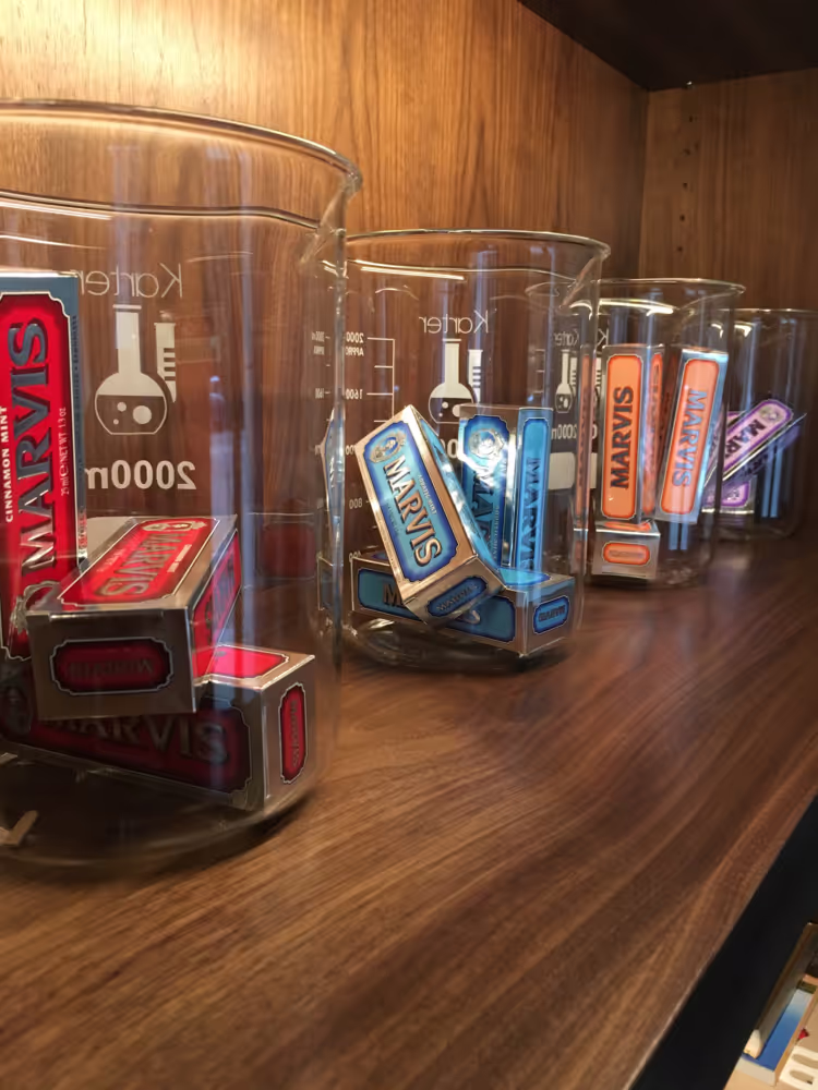 Detail shot of Smilebar product display featuring Marvis toothpaste in lab-style jars