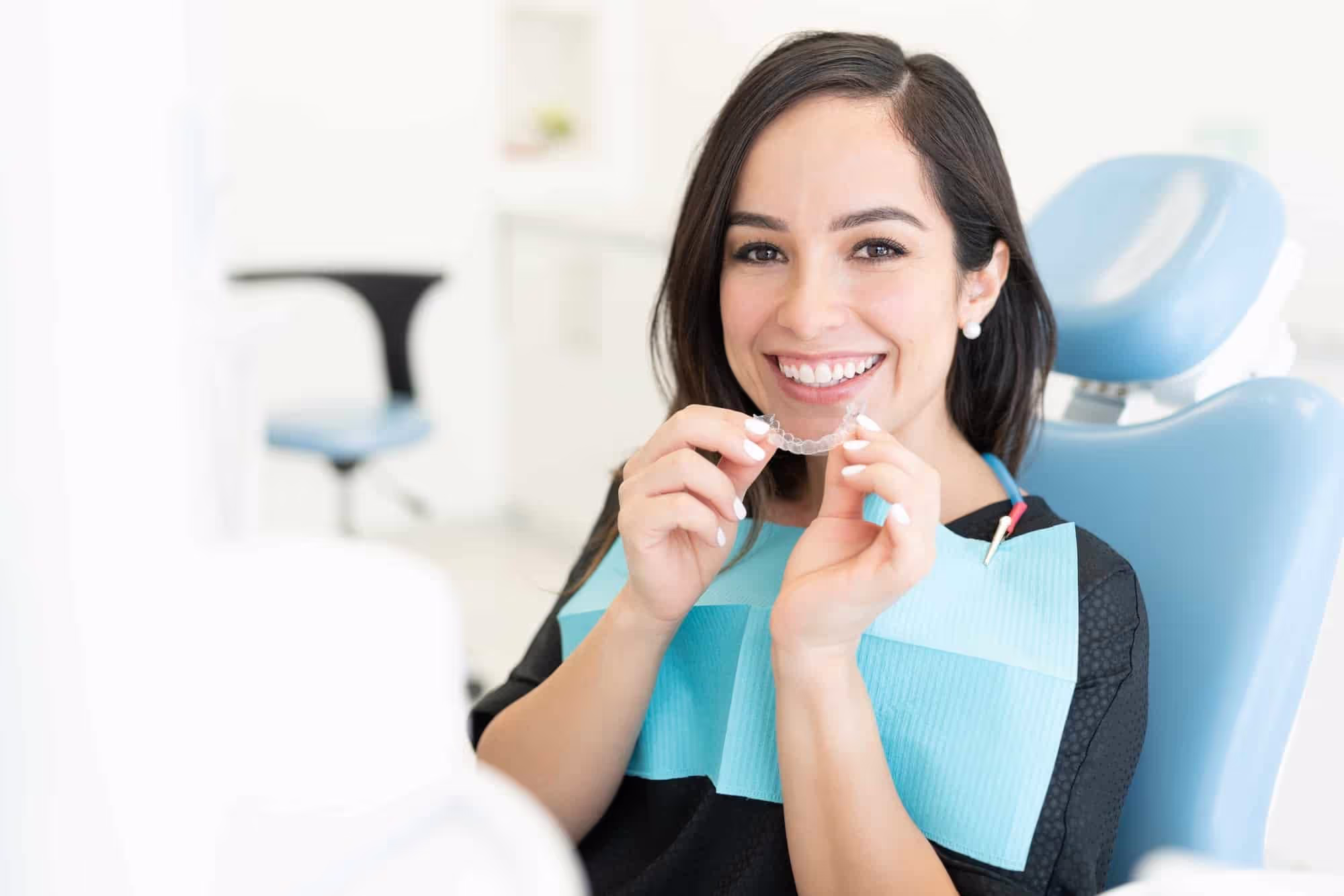 Happy patient preparing for Invisalign treatment at dental clinic